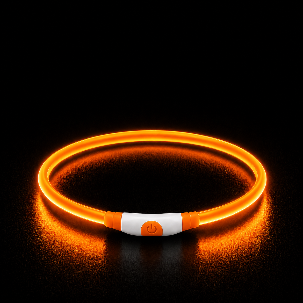Neon orange LED dog collar with power button on a black background