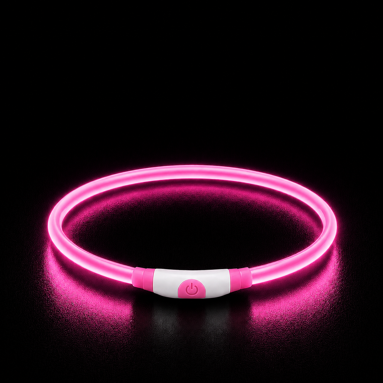Pink LED dog collar on a black background